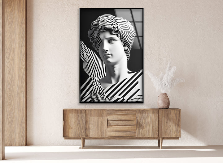 Striking Sculpture Art: A contemporary abstract design on glass, combining classical sculpture with modern black-and-white stripes.
