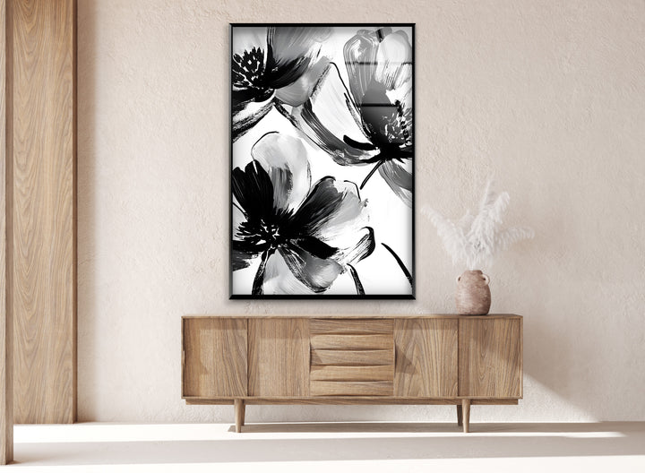Minimalist yet expressive black and white floral artwork, adding charm to any space.
