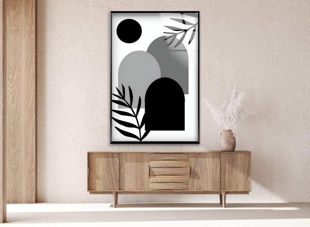 A bold yet subtle black and white painting featuring overlapping abstract shapes.

