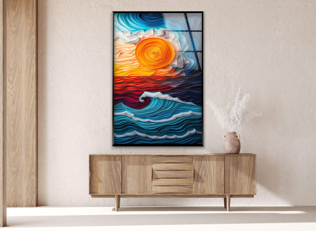 Glass wall art displaying bold, fluid wave patterns in rich blues and fiery oranges.

