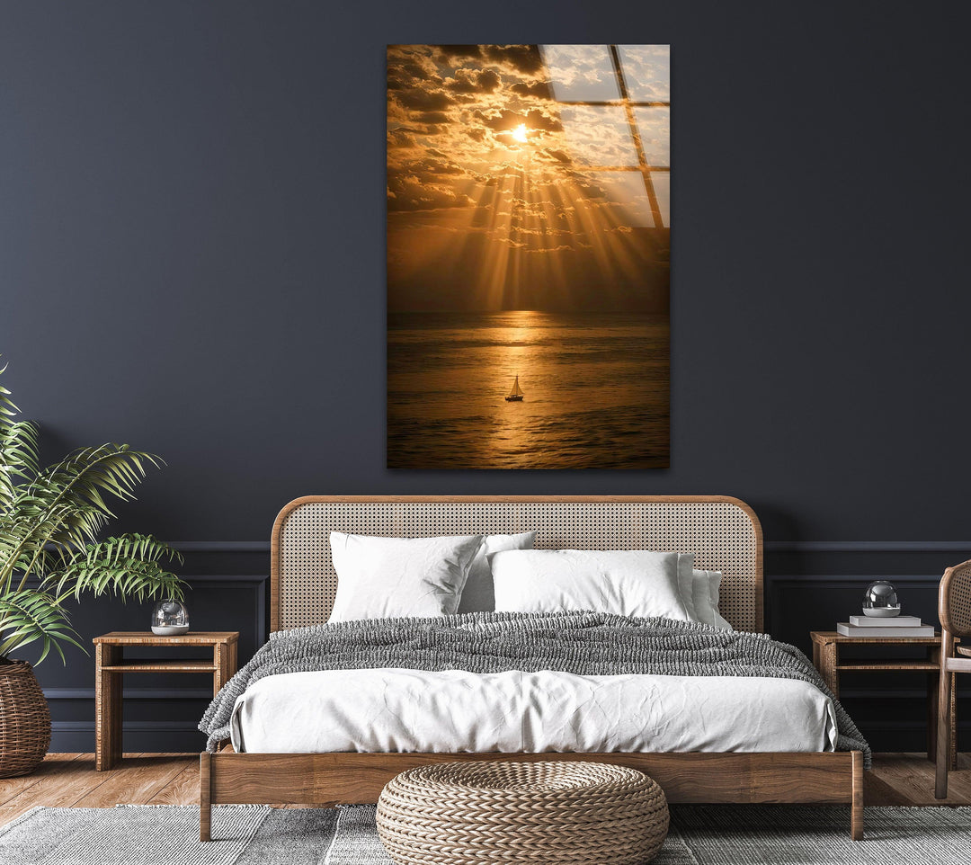 Golden Glow Over the Sea - Gorgeous sunset reflection on calm waters, with a sailboat setting sail under warm golden skies.
