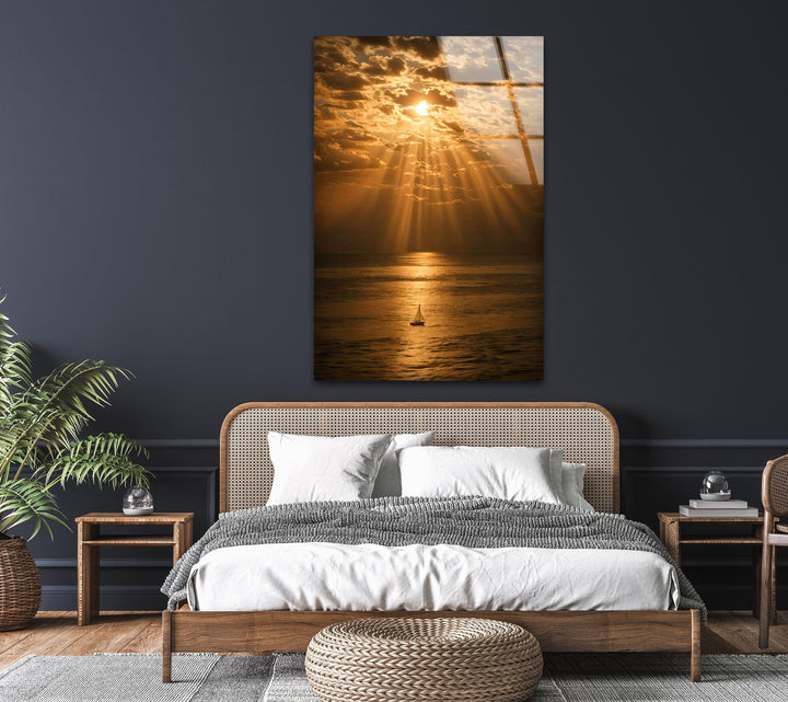 Golden Glow Over the Sea - Gorgeous sunset reflection on calm waters, with a sailboat setting sail under warm golden skies.
