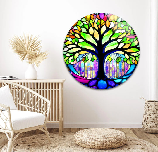 Negative space surrounds the stained life of tree art from glass, emphasizing its radiant colors and circular shape against the neutral wall.