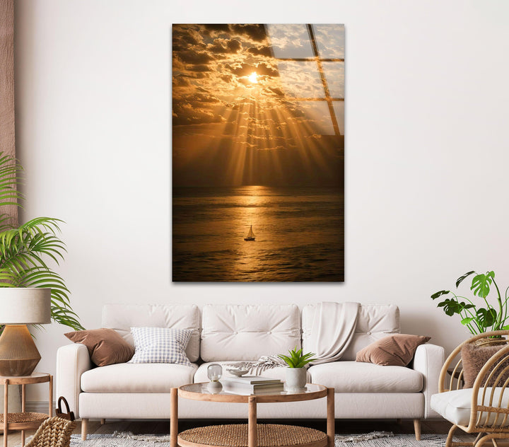 Calm Waters and Golden Skies - A captivating glass print showcasing a sailing boat in the glow of a golden sunset over the ocean.
