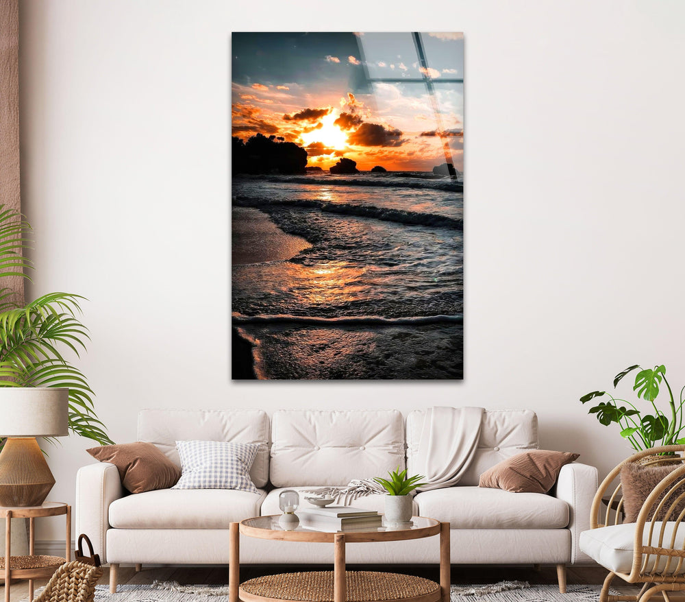 Tranquil coastal scene captured at sunset, showcasing the golden light over the water.
