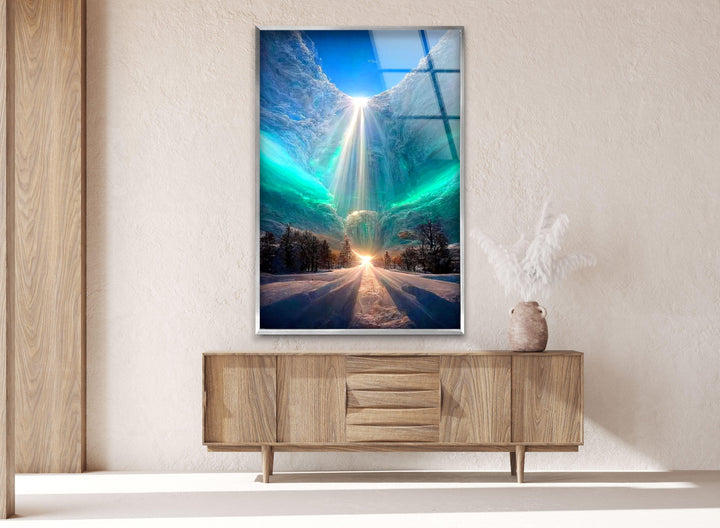 Majestic glass wall art featuring a snow-covered forest under an ethereal light.
