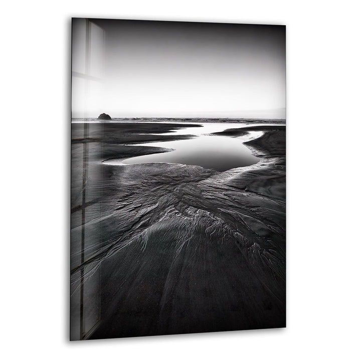 A breathtaking glass wall art featuring a monochrome beach landscape with serene coastal elements.

