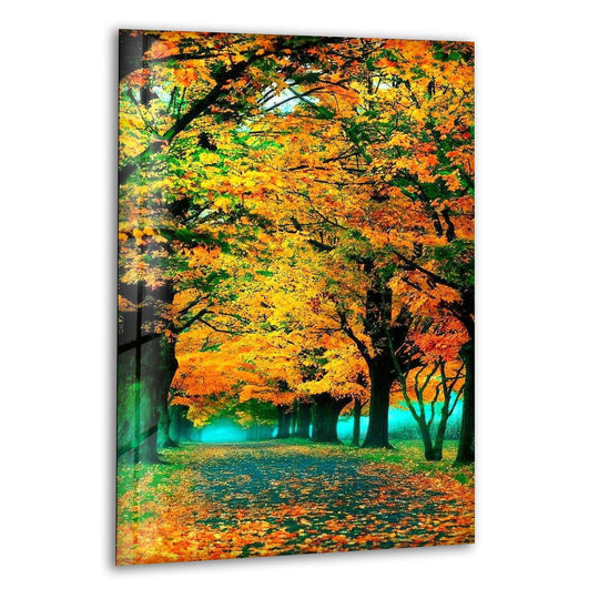 Dramatic color contrast illuminates the vibrant fall forest pathway in this golden autumn glass wall art, making it one of the best glass art options.
