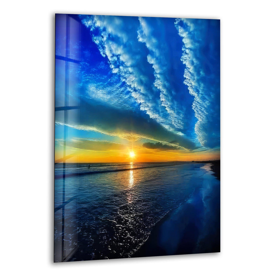 Stunning ocean sunset with dramatic cloud formations, printed on glass wall art.
