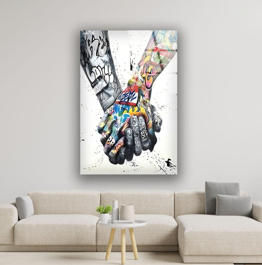 Graffiti handshake glass wall art showcases hands clasped with bold black and white graffiti on one side and vibrant colored graffiti on the other, as a unique print wall art.