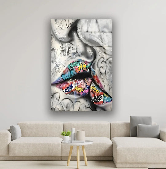 Graffiti lips glass wall art radiates a bold, urban mood, inviting a cool and edgy atmosphere into any space.
