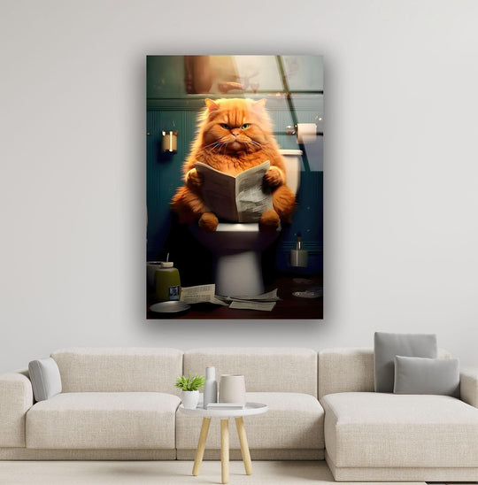 A fluffy orange cat reading a newspaper on the toilet creates a comical visual rhythm in this print wall art.