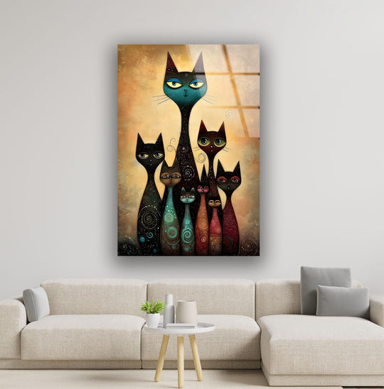 Abstract glass art painting features a textured, warm ochre background behind a whimsical family of stylized cats with smooth, patterned bodies.