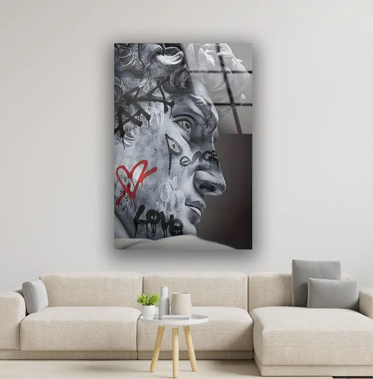 A bright close-up showcases the striking detail of a statue, with 'love' and 'peace' graffiti, as unique modern wall decor.