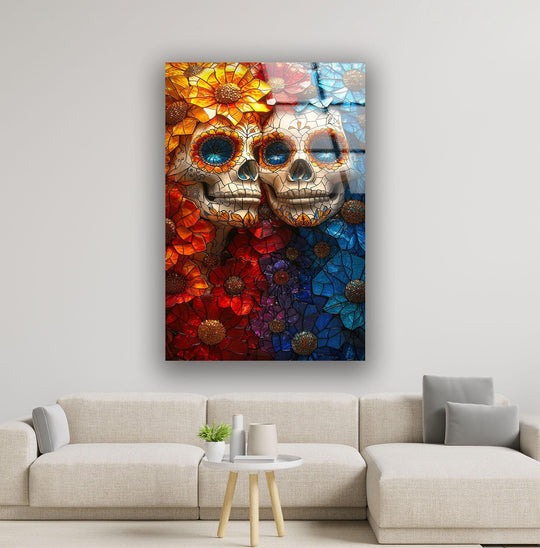 A serene tableau of two sugar skulls, adorned with stained glass flowers, evokes a striking stillness as decorative wall art.