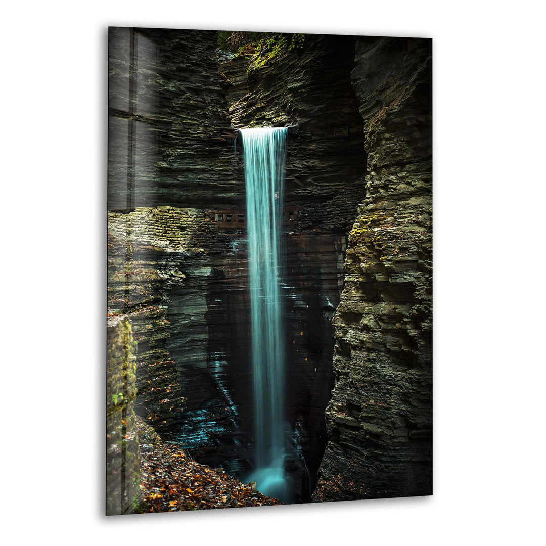 Breathtaking waterfall cascading through a rugged rock gorge, captured in high-definition glass wall art.
