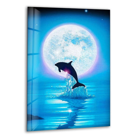 A silhouette of a dolphin leaping from turquoise water into a glowing full moon, a striking piece of hanging wall art.