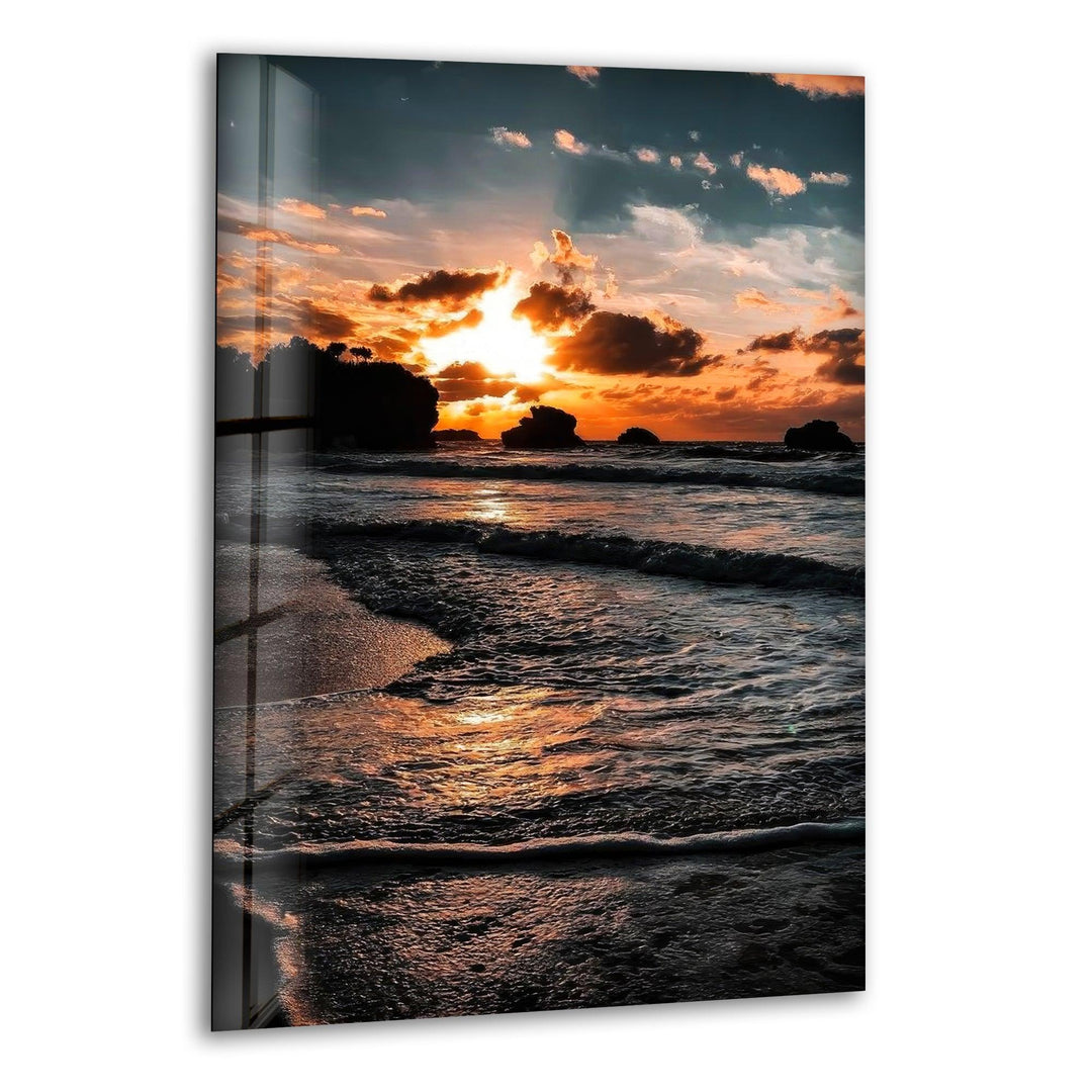 A peaceful sunset at the beach, with golden hues reflecting over the calm ocean waves.
