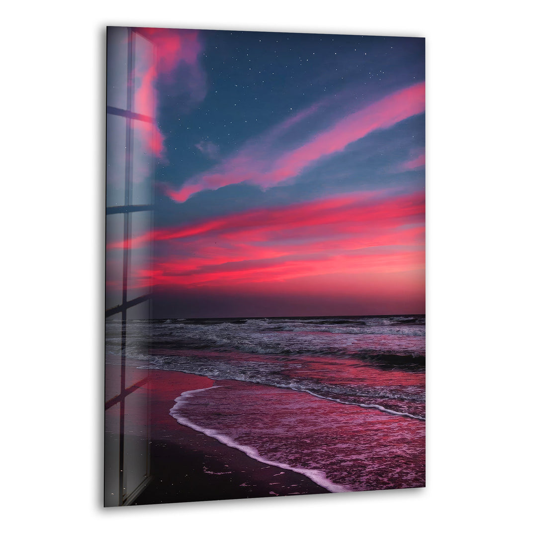 Dramatic crimson and purple sunset over ocean waves, printed on glass wall art.
