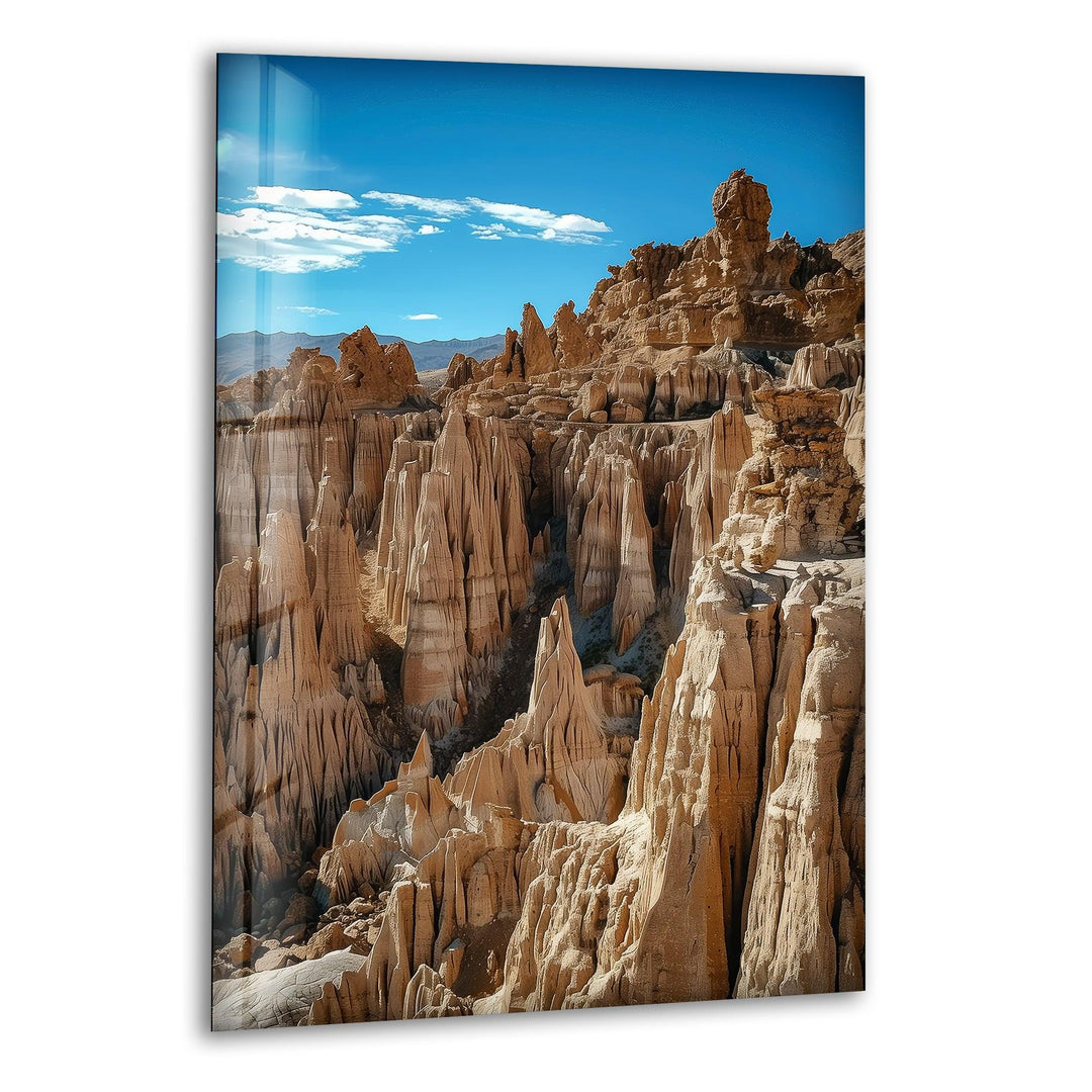Glass wall art featuring breathtaking canyon rock formations in a desert landscape.
