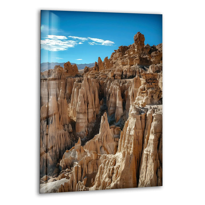 Glass wall art featuring breathtaking canyon rock formations in a desert landscape.
