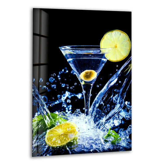 Vibrant blue and yellow cocktail drinks glass wall art featuring a martini glass with splashing liquid and lime slices in a vertical orientation.