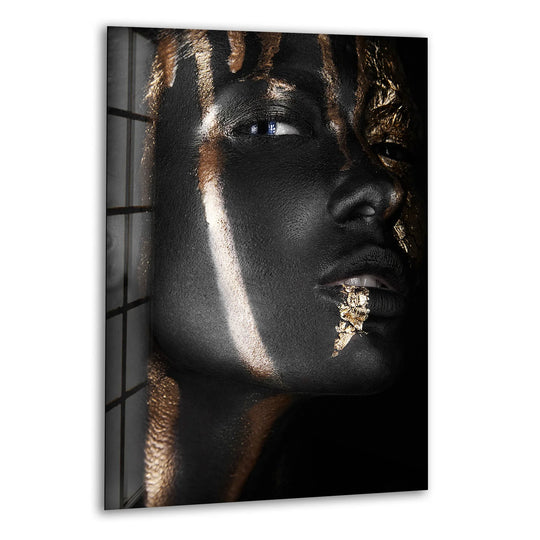 Abstract gold and black woman portrait on hanging wall art, featuring striking textures and luminous accents.