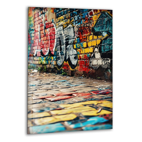 Layered graffiti on brick and cobblestone creates a vibrant urban home decor scene with striking depth.