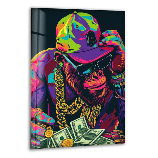 A stylized ape wearing a backwards baseball cap and gold chains against a dark background, part of glass wall art decor.
