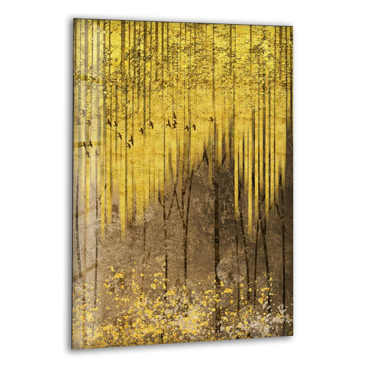 Golden forest art is a glass wall art showing abstract tree trunks and flying birds in brown and gold tones and it makes elegant nature wall decor