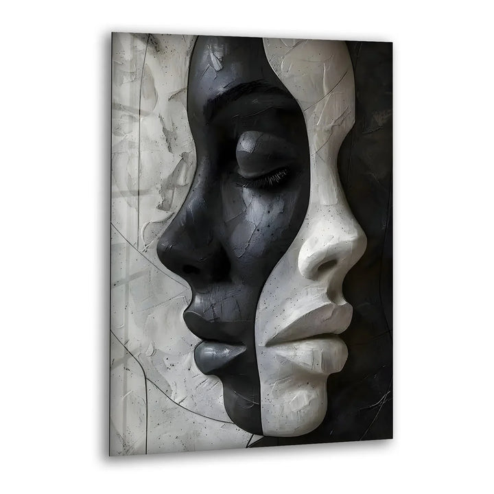 Black and white glass wall art featuring two merged female faces symbolizing duality in abstract form.