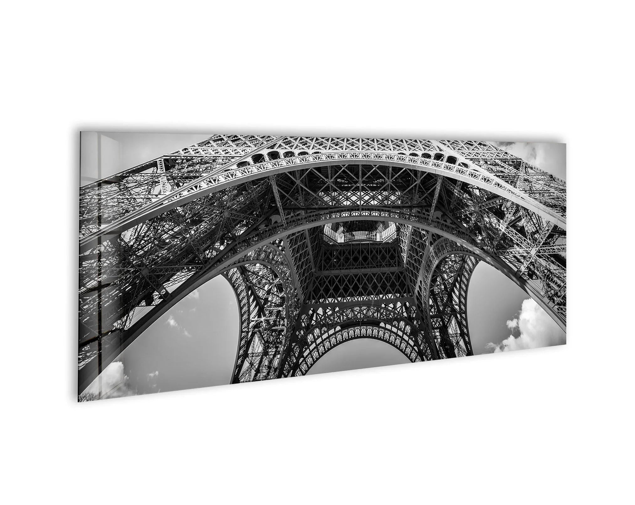 Black and white glass wall art featuring an upward architectural view of the Eiffel Tower.
