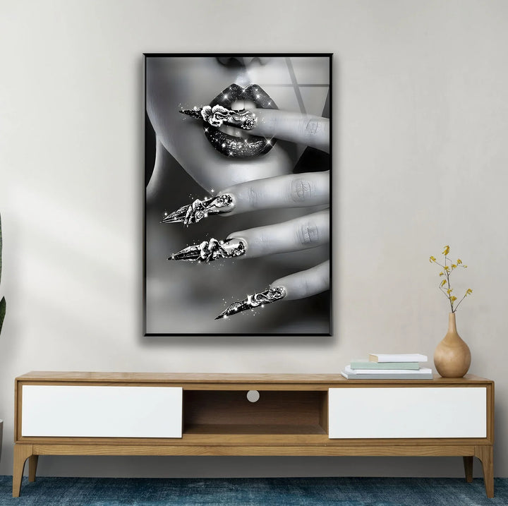Black and white contemporary beauty art with shimmering lip gloss and ornate nail accents.