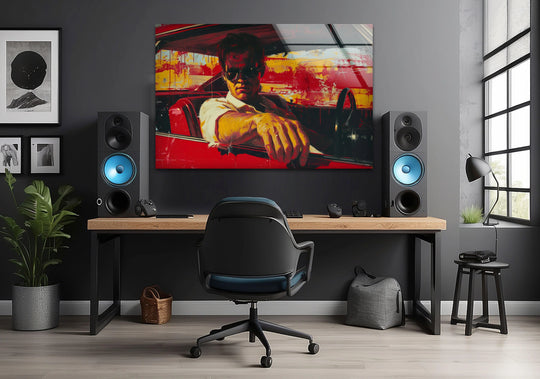 Rectangular wall art prints of a retro driver in a red car displays dynamic geometric shapes, with the window creating a prominent linear element above the desk.