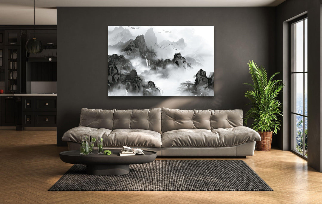 Black and white glass wall art depicting misty mountains with waterfalls and distant flying birds.