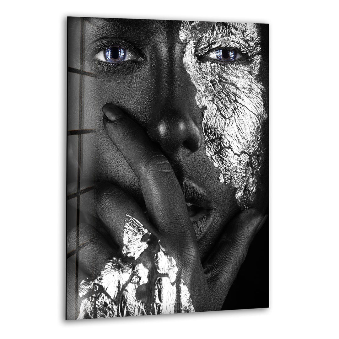 Abstract metallic face close-up with blue eyes presented as luxury glass wall art.