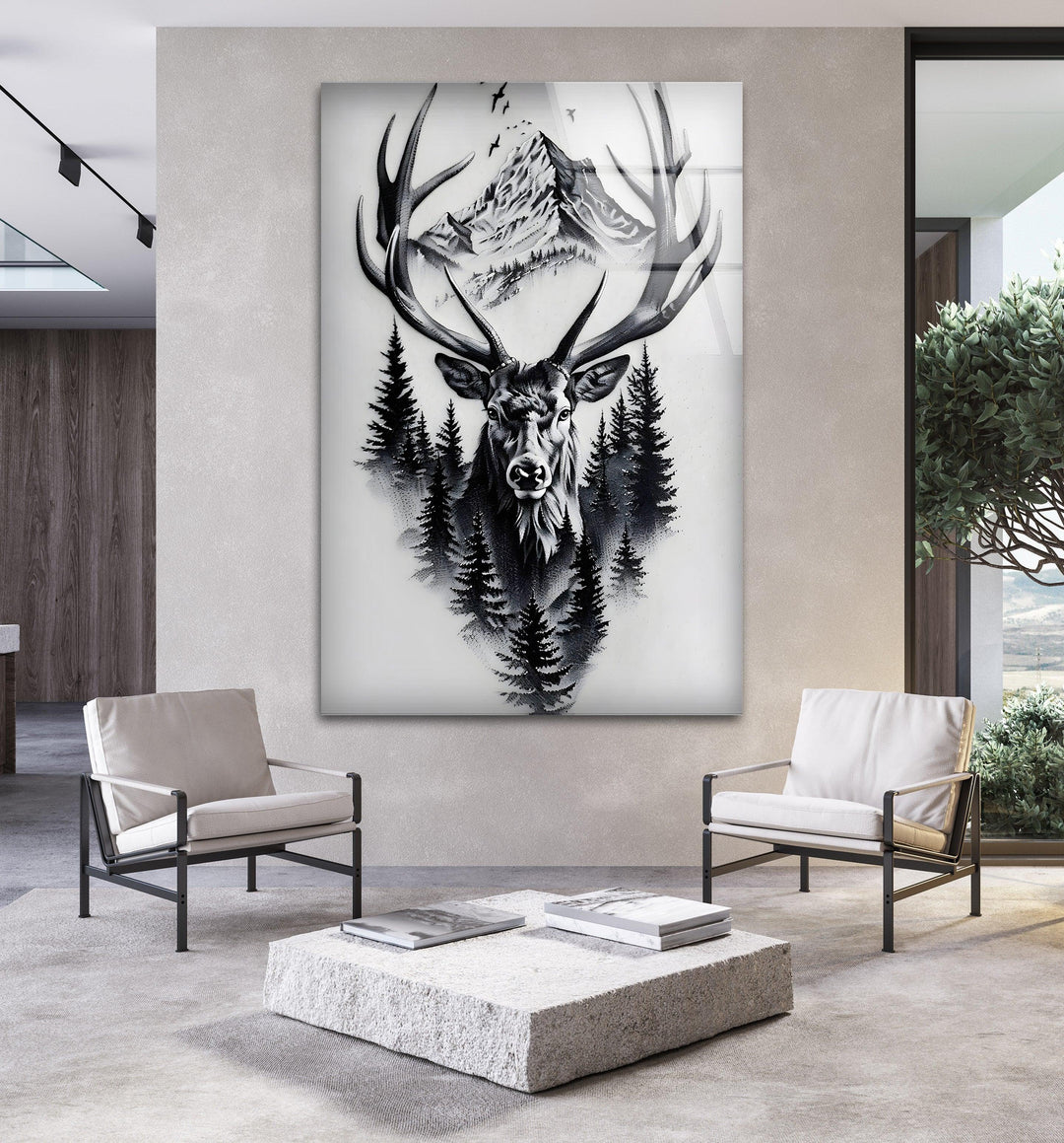 Black and white glass art showing a powerful stag emerging from dense pine trees and mountains.