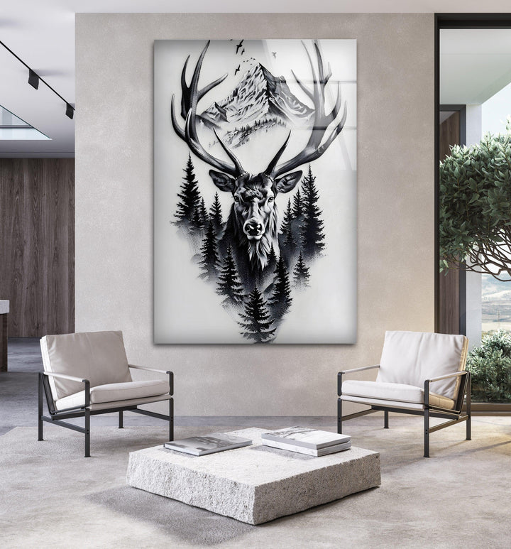 Black and white glass art showing a powerful stag emerging from dense pine trees and mountains.