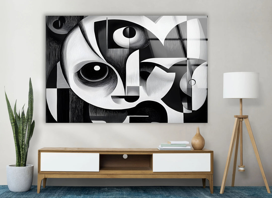 Artistic cubist-inspired face composition on tempered glass with sharp contrasts and circular eyes.
