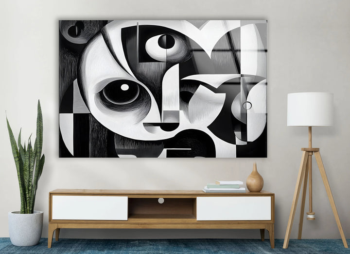 Artistic cubist-inspired face composition on tempered glass with sharp contrasts and circular eyes.