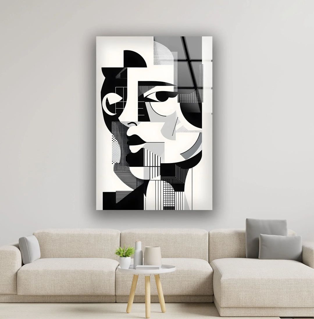 Black and white glass wall art featuring a geometric abstract portrait of a woman with sharp angular shapes.