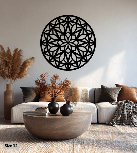 Layered shadows enhance the depth of this mandala's laser-cut design, offering striking metal artwork for a modern, geometric focal point.