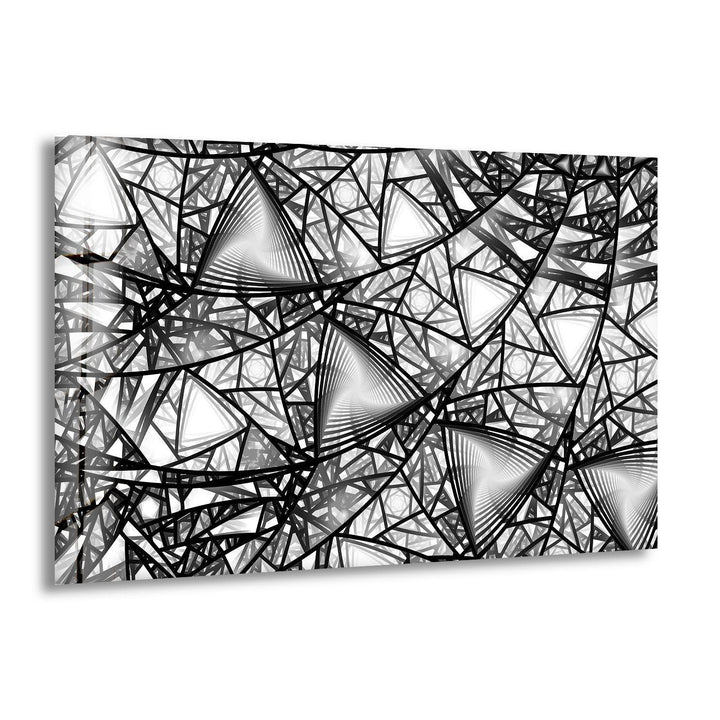 Geometric black and white glass wall art featuring layered triangular patterns and abstract linework.