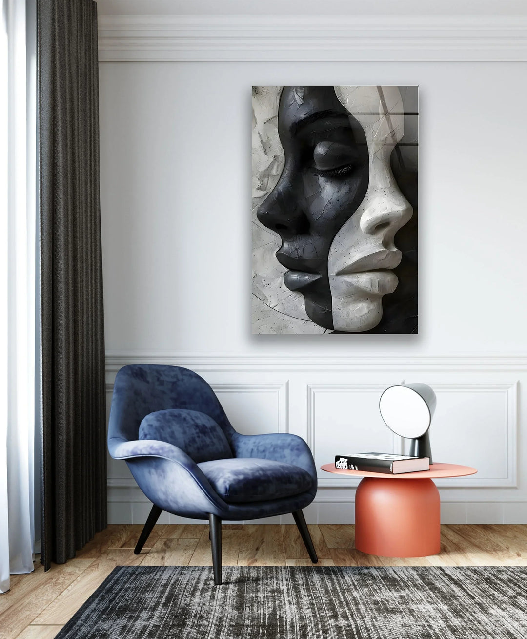 Glass wall art of intertwined faces in grayscale illustrating harmony between opposing forms.