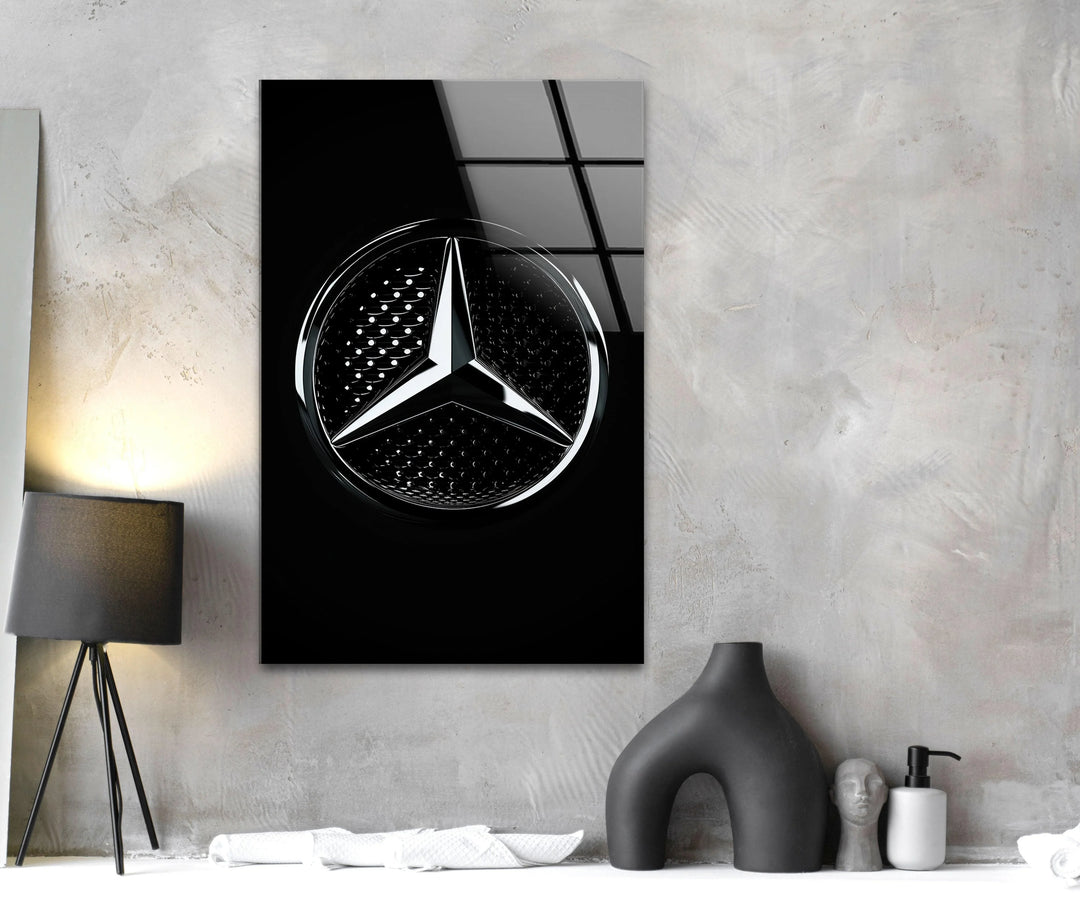 Contemporary glass decor featuring a precision-shaped chrome star against a deep black surface.