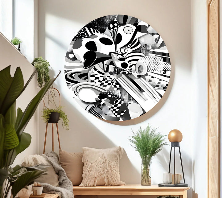 Black and white abstract print on glass featuring curves, dotted patterns, and layered dynamic shapes.