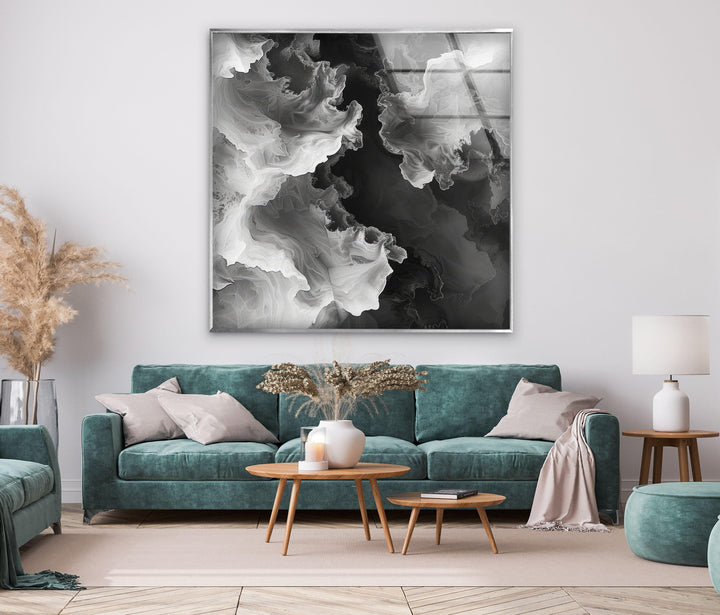 Fluid monochrome artwork on glass depicting swirling ethereal forms in high-contrast tones.