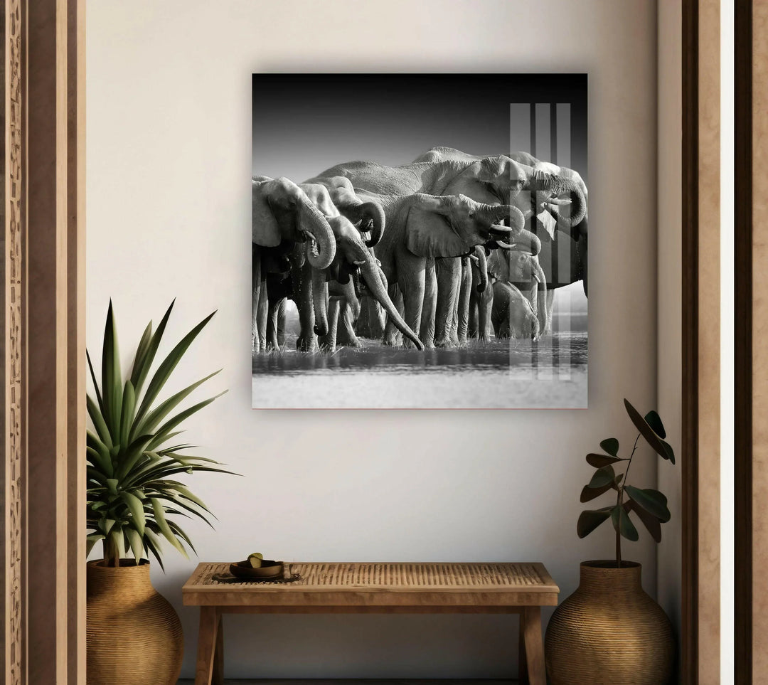 Glass panel artwork showcasing an elephant herd in a serene natural setting.