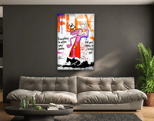 Behind the motivational urban glass wall art, a unique modern wall decor contrasts a dark grey wall with a plant in a wicker basket and a grey sofa.