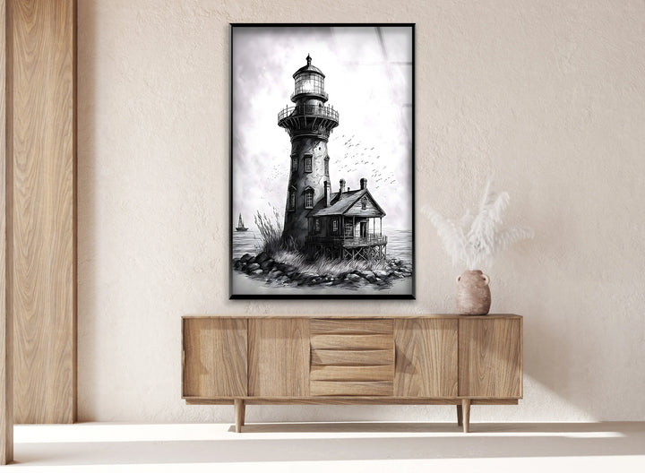 Monochrome nautical glass art with a lighthouse, cottage, and distant sailboat.